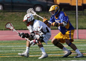 From right, Mahopac's Chase Thompson (6) puts pressure on White Plains Ryan McGee (8), during first half action at White Plains High School May 25, 2010. ( Frank Becerra Jr. / The Journal News )